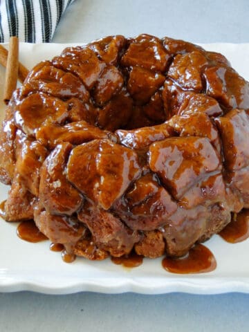Side view of monkey bread on a white platter.