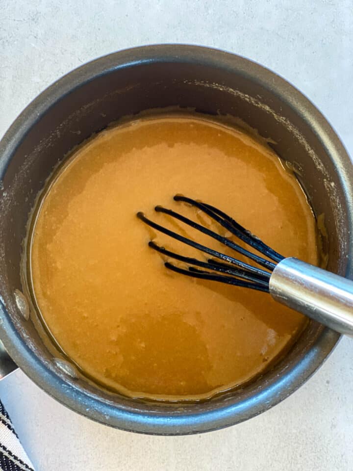 Butter and brown sugar sauce in small saucepan with whisk.