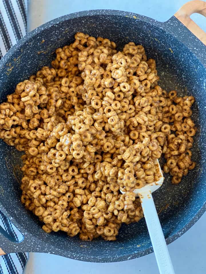 Cereal peanut butter mixture all stirred together in large pot.