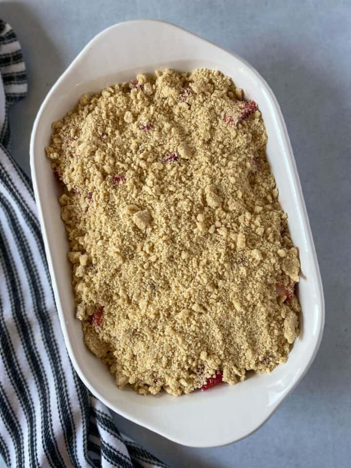 Crumble topping put on top of strawberry filling.