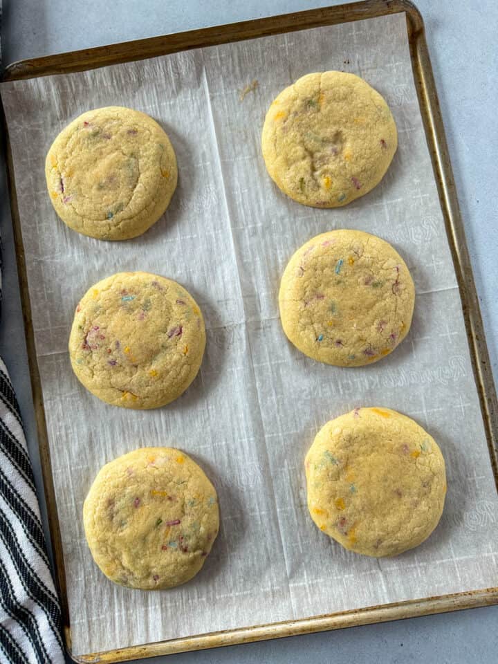 Cookies baked on cookie sheet with parchment paper.