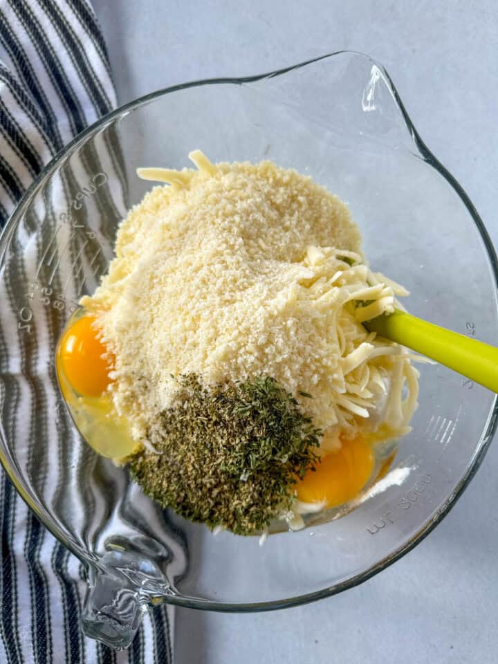 Ricotta filling ingredients added to mixing bowl.
