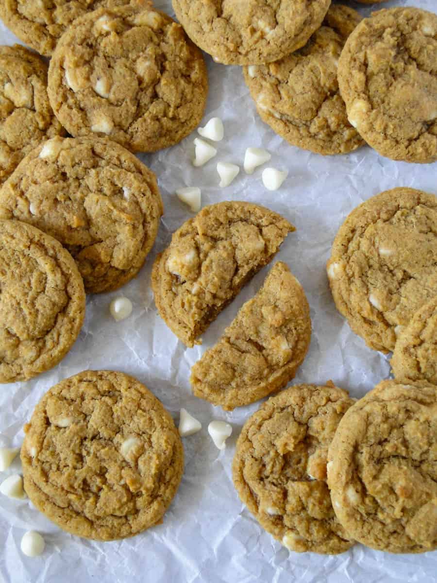 Top view of cookies in piles with one cookie cut in half.