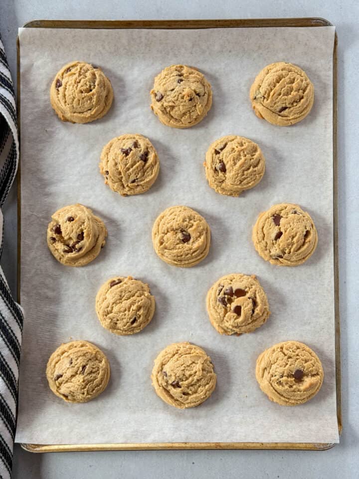 Baked cookies on parchment lined sheet pan.