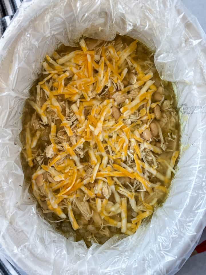 Shredded cheese added to crock pot.