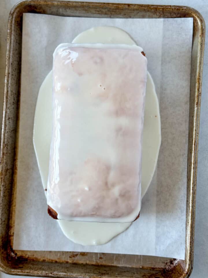 Glazed poured over lemon pound cake.