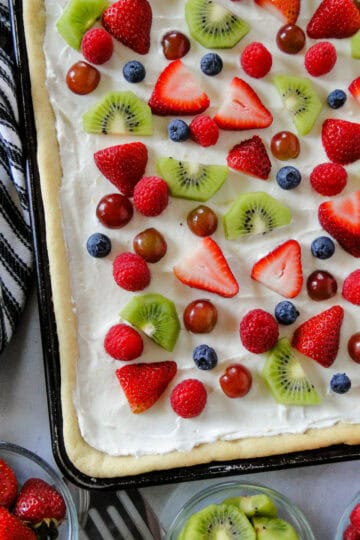 Top view of easy fruit pizza in sheet pan.