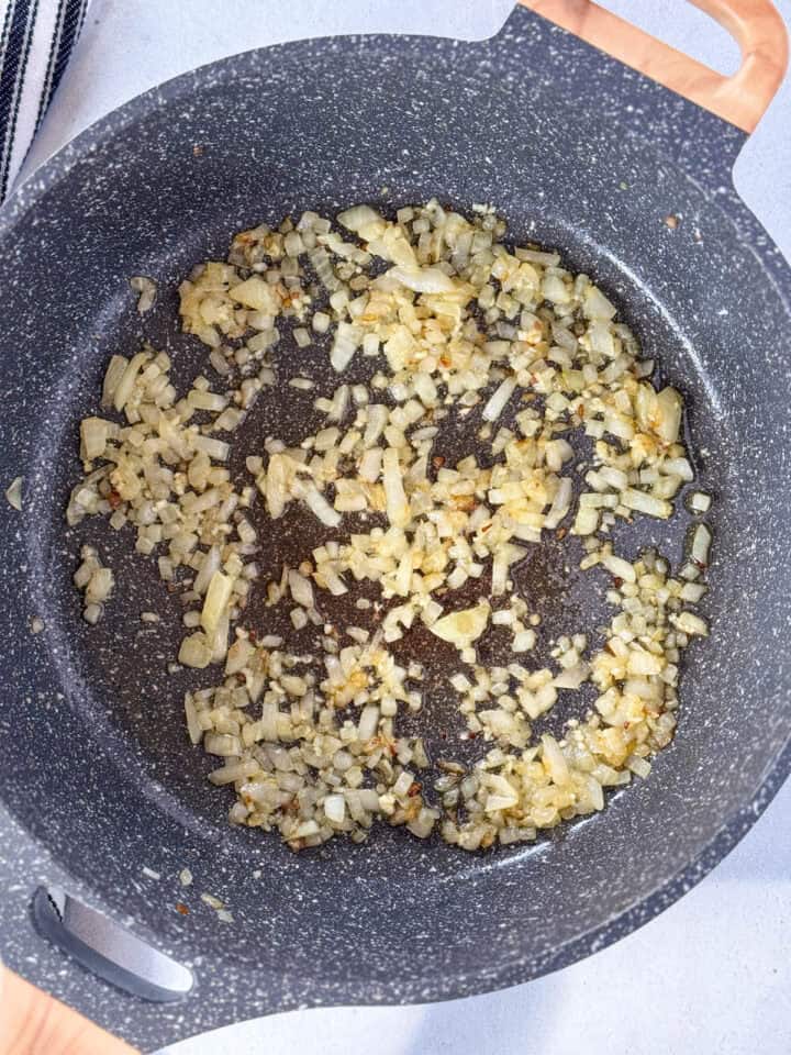 Sauteed onions and garlic in large skillet.