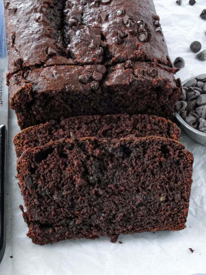 Close up front view of double chocolate banana bread slices layered.