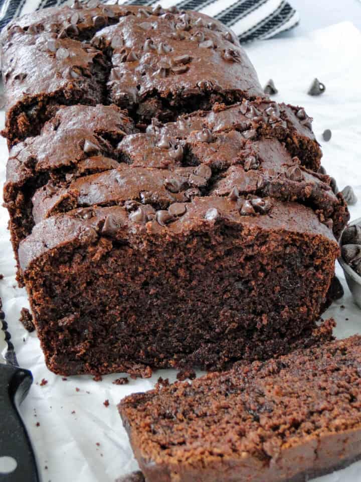 Front view of double chocolate banana bread slices with one slice laying down showing center of bread.