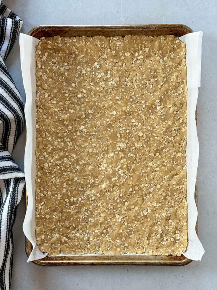 Oat mixture pressed into parchment lined 9x13 pan.