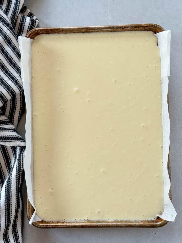 Cream cheese filling added on top of partially baked crust in 9x13 pan.