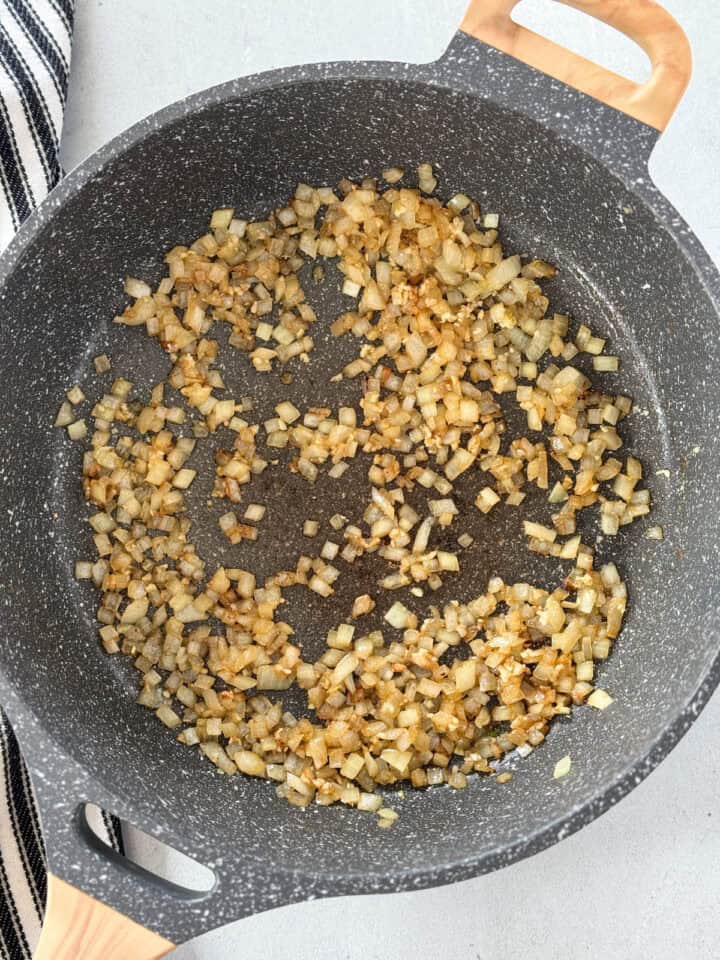 Cooked onions and garlic in skillet.