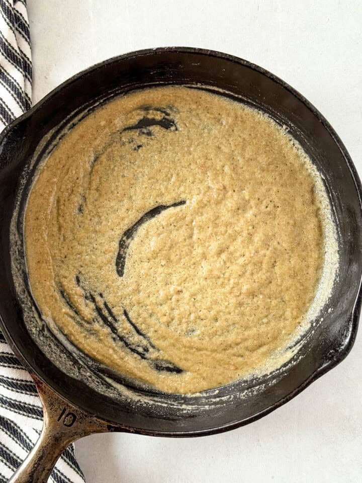 Roux ingredients whisked together in skillet.
