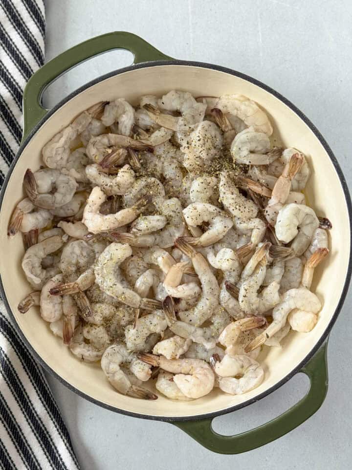 Shrimp added to skillet with butter.