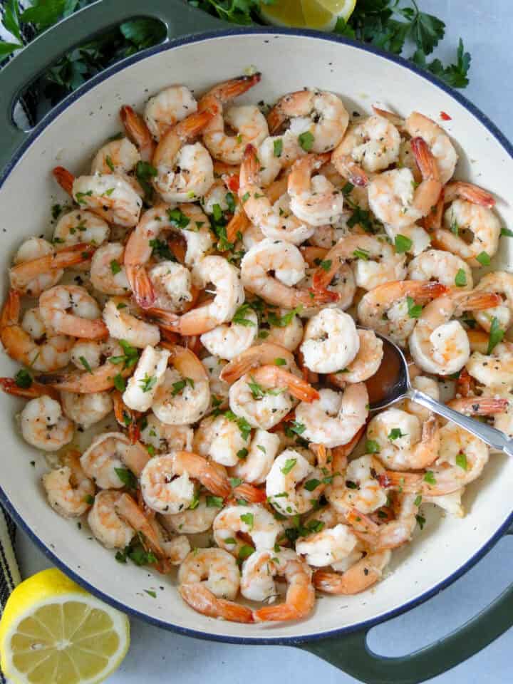 Top view of garlic butter shrimp in skillet.