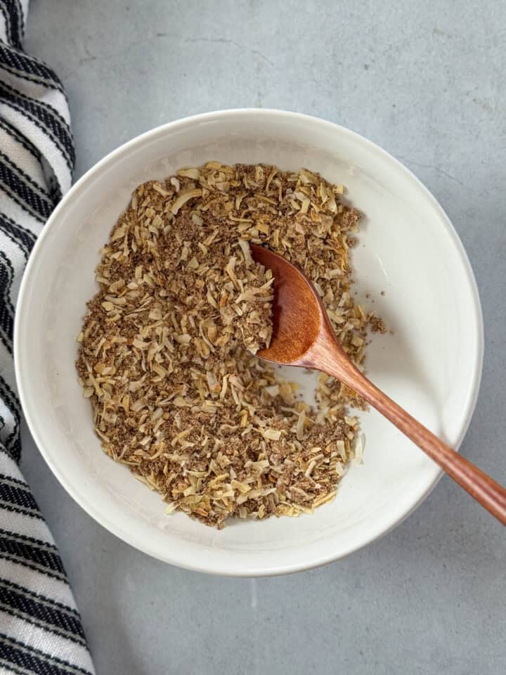 All ingredients mixed together in bowl with spoon.