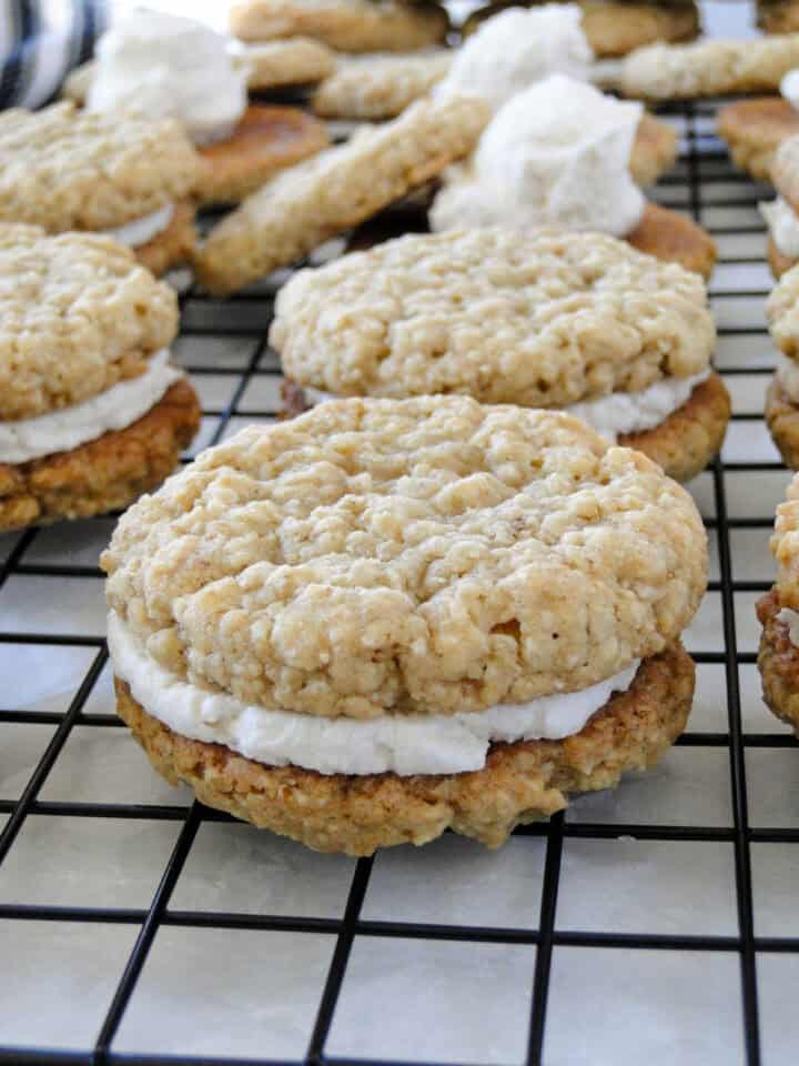 Side view of oatmeal cream pies on wire rack.