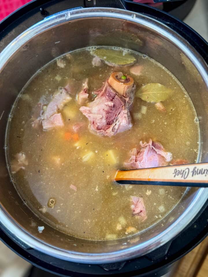 Broth added to instant pot and stirred all together with wooden spoon.