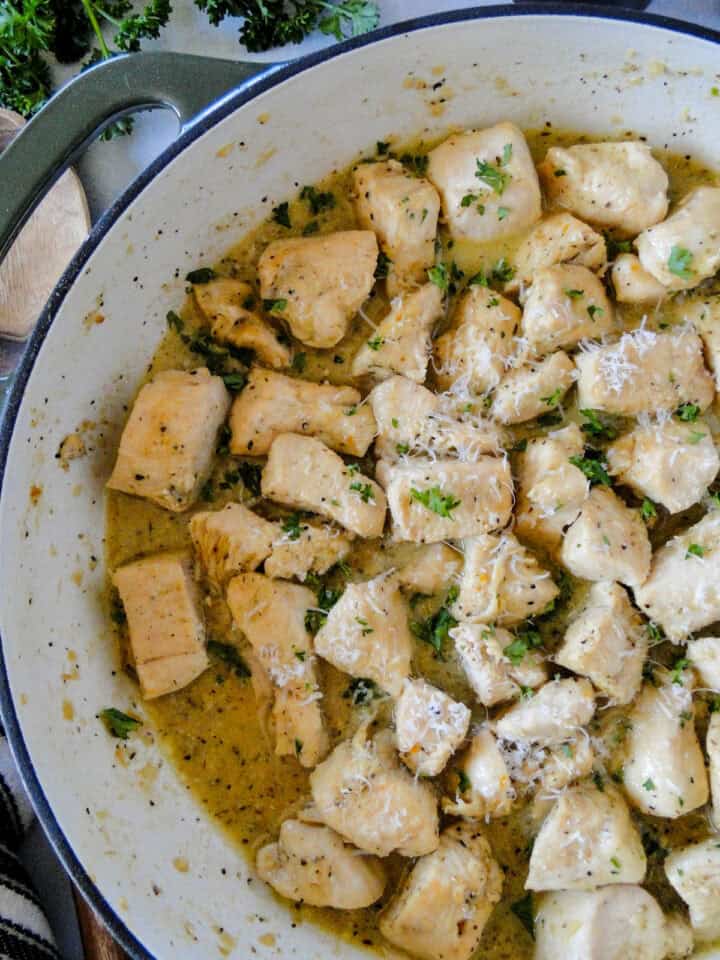 Close up top view of garlic butter chicken bites in skillet.
