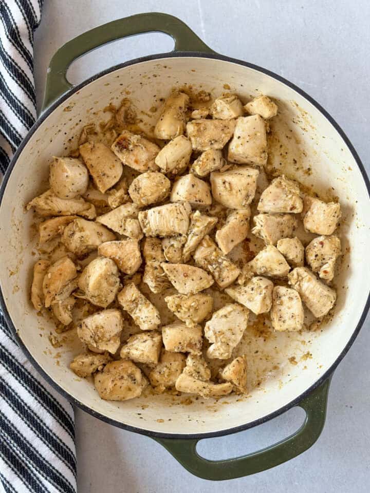 Chicken bites seared in large skillet.