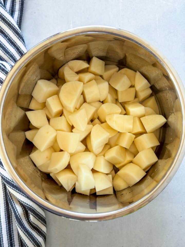 Diced potatoes, water and salt added to instant pot.