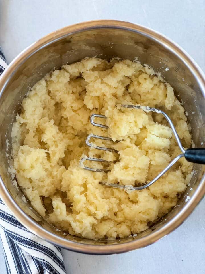 Cooked potatoes mashed with butter in instant pot.
