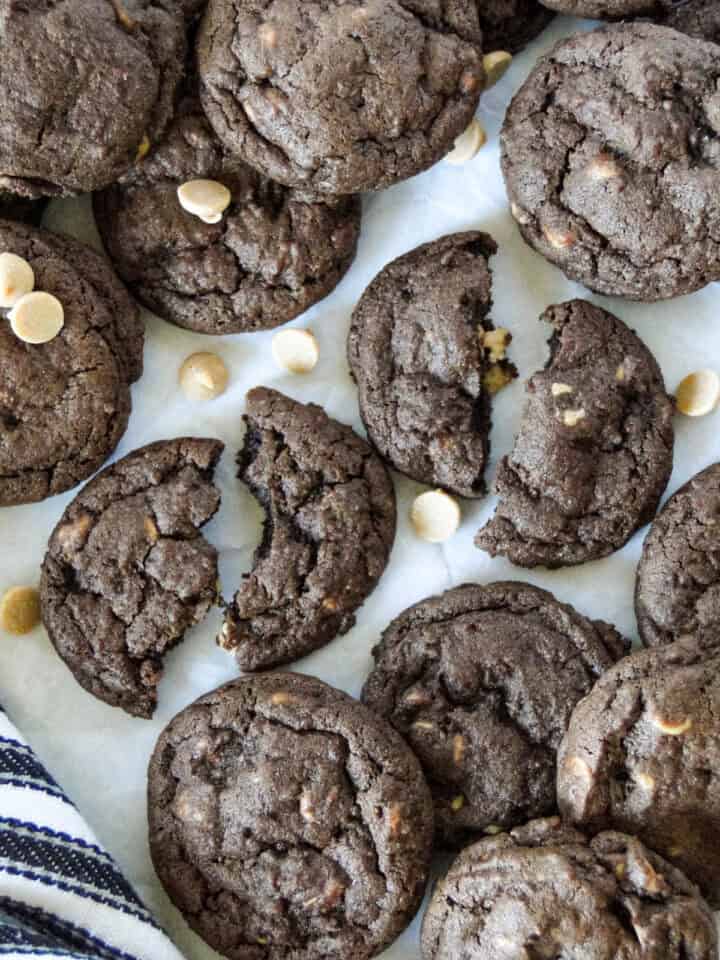 Top view of broken in half cookies surrounded by more cookies.