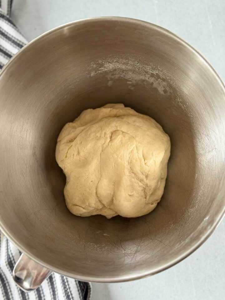 Bread dough in oiled mixing bowl.